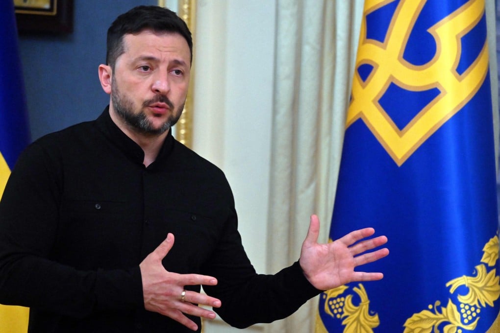 Ukraine’s President Volodymyr Zelensky speaks to the media during a press briefing after his phone call with the US president, in Kyiv, on Monday. Photo: AFP