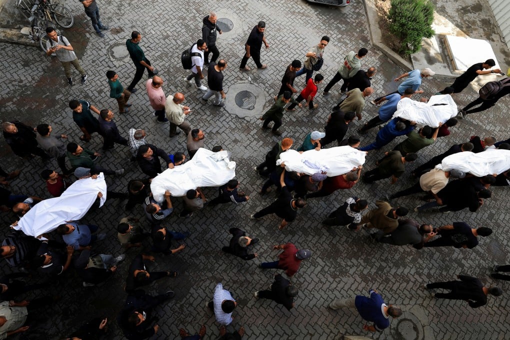 Mourners in Gaza City carry the bodies of Palestinians killed in Israeli strikes on Tuesday. Photo: Reuters