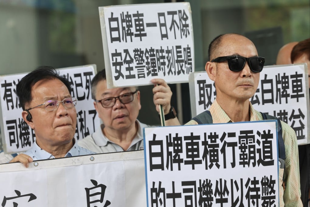 More than 30 disgruntled taxi drivers held a demonstration on May 9 outside government headquarters and petitioned for tougher action against illegal ride-hailing services. Photo: Edmond So
