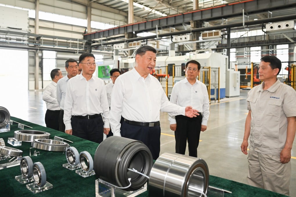 President Xi Jinping learns about local efforts to accelerate the development of advanced manufacturing while visiting the Luoyang Bearing Group in Luoyang, Henan province, on Monday. Photo: Xinhua