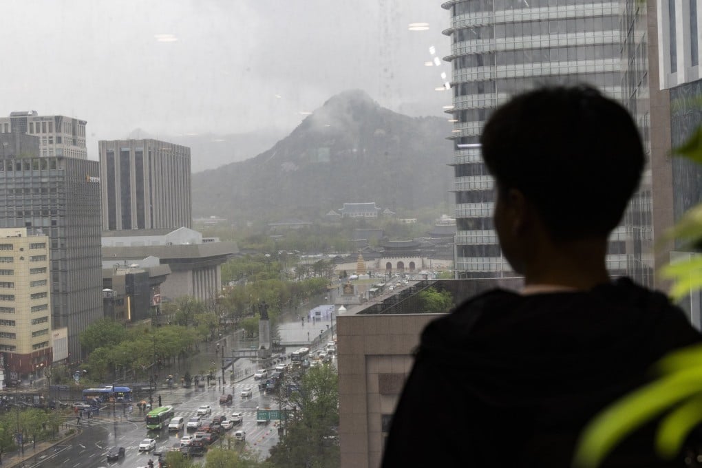 A North Korean defector looks out from a balcony across Seoul, South Korea. Thousands of North Koreans have fled the country since the late 1990s, but the numbers have dwindled drastically in recent years. Photo: EPA-EFE