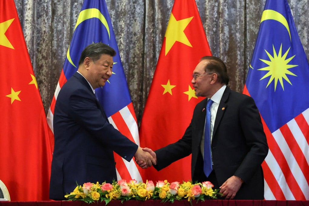 Chinese President Xi Jinping (left) shakes hands with Malaysian Prime Minister Anwar Ibrahim (right) in Putrajaya outside Kuala Lumpur on April 16. File photo: Reuters