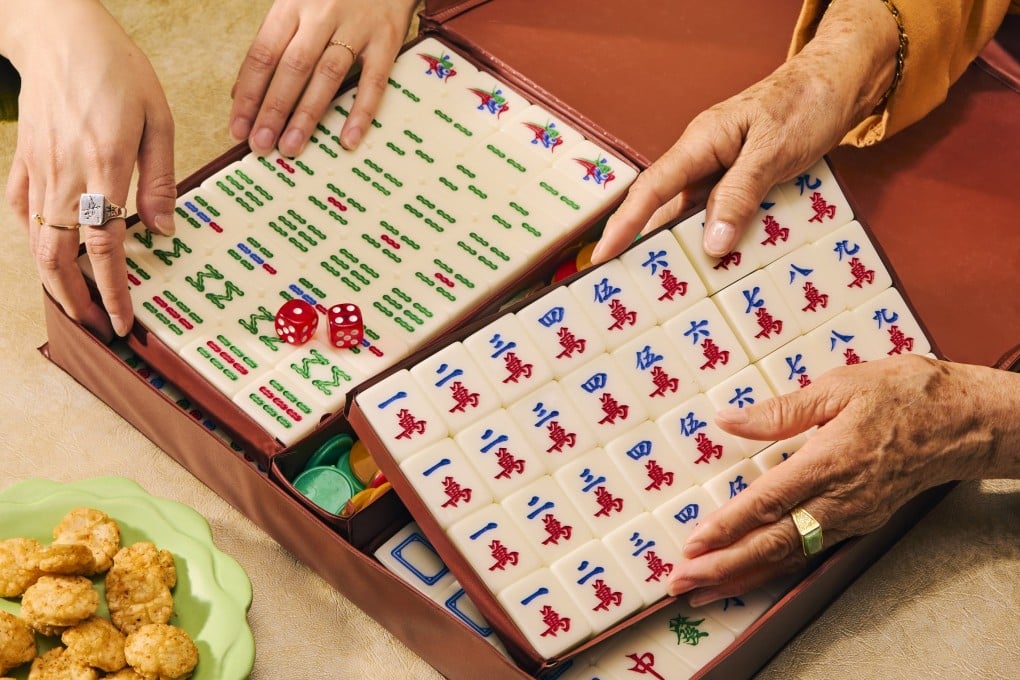 A photo from Nicole Wong’s book, Mahjong: House Rules from Across the Asian Diaspora. The photographs in the book feature personal props, as well as hands from multiple generations of Wong’s family. Photo: Andria Lo