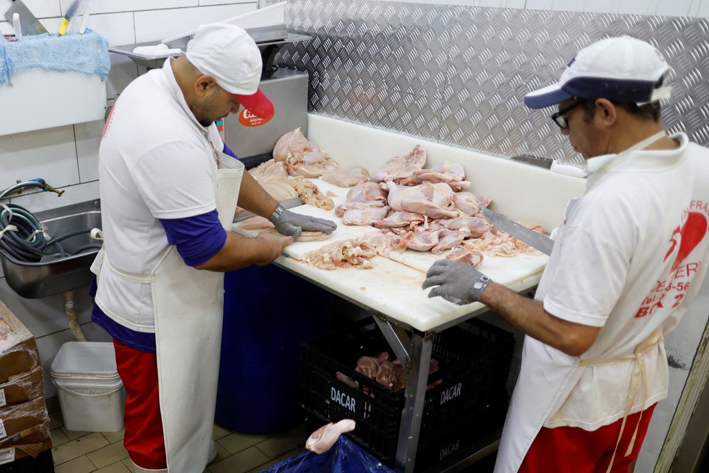 Chicken vendors work in a market in Sao Paulo, Brazil on Tuesday. Photo: Reuters