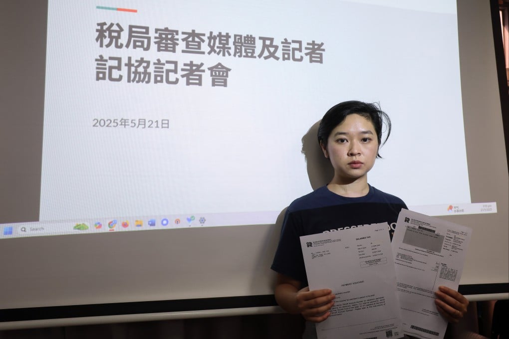 Hong Kong Journalists Association chairwoman Selina Cheng holds up a tax demand. Photo: Edmond So
