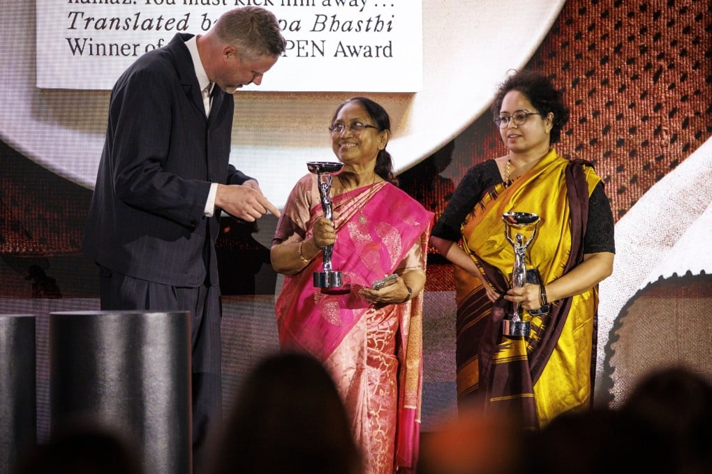 Indian lawyer and activist Banu Mushtaq (centre) and translator Deepa Bhasthi accept the 2025 International Booker Prize for Heart Lamp, the first book originally written in Kannada, a southern Indian language, to win the prize. Photo: EPA-EFE