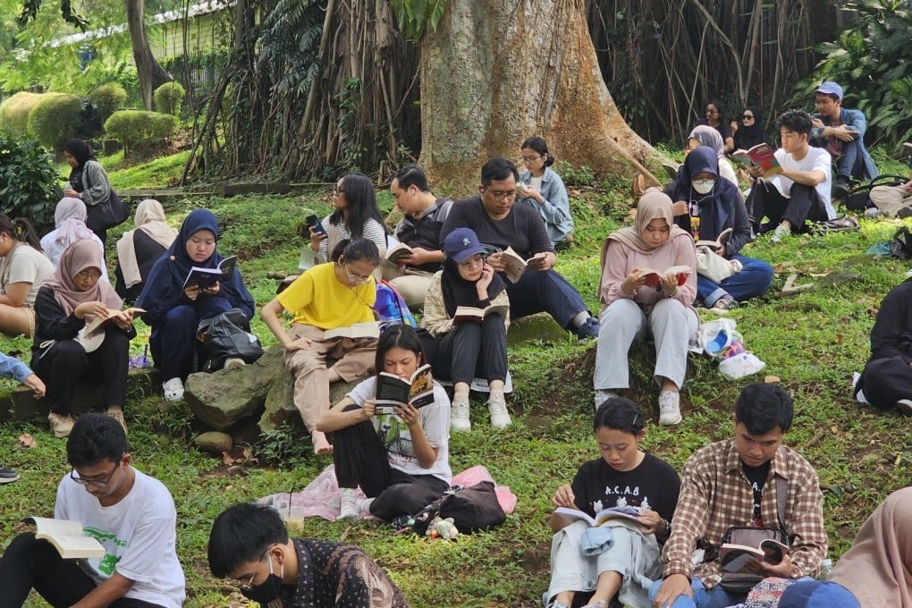 People read books in a park in Jakarta, Indonesia, as part of an event organised by Silent Book Club Jakarta. Photo: Silent Book Club Jakarta