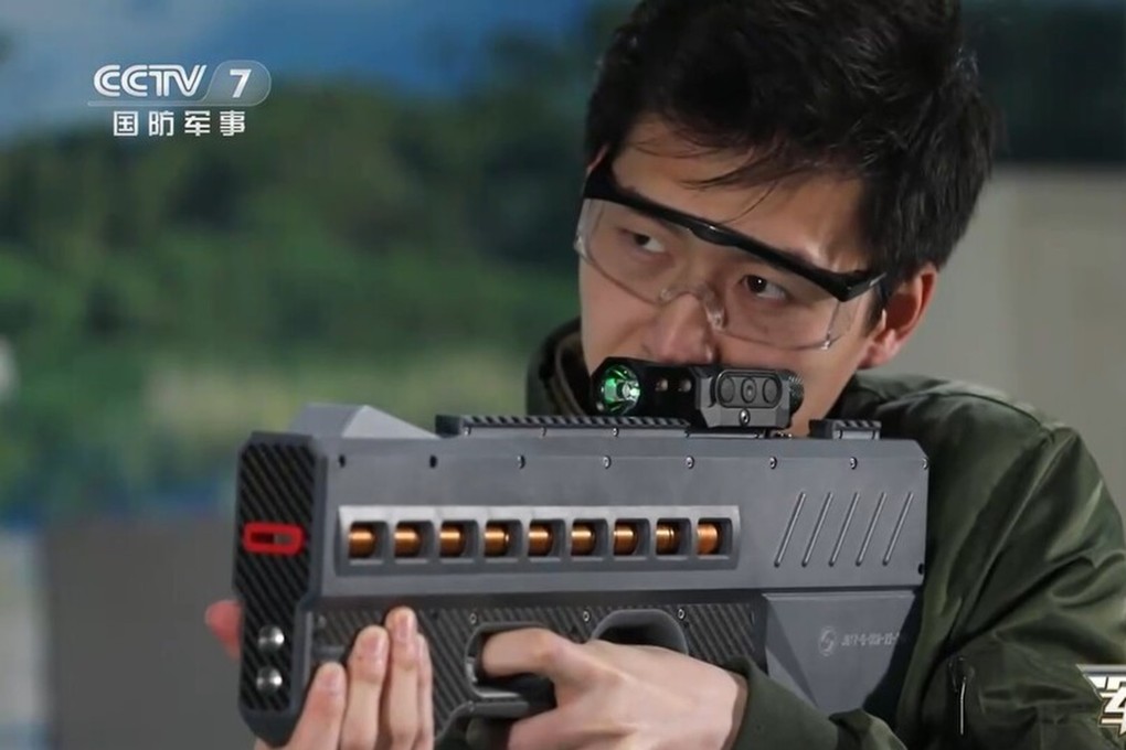 China has unveiled a powerful new electromagnetic gun believed to be powered by lithium batteries. This version (pictured) is a non-lethal weapon that fires coin-shaped bullets with electromagnetic force and would be used for riot control.  Photo: CCTV