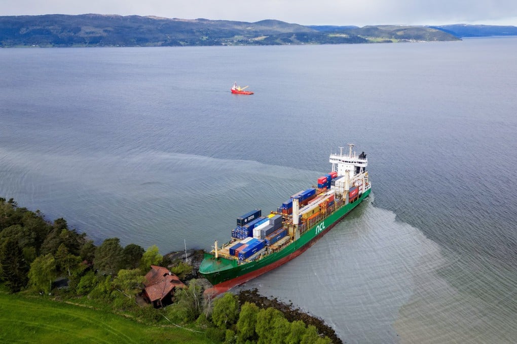 The 135m container ship that ran aground almost hitting a house in the Trondheimsfjord outside Byneset, Norway on Thursday. Photo: EPA-EFE