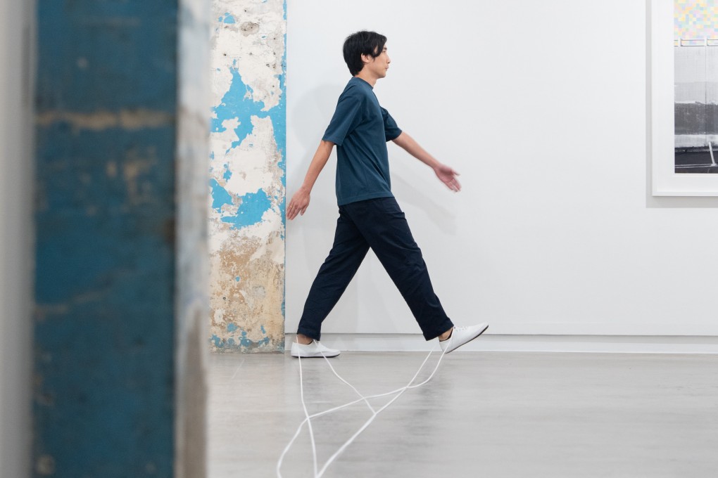 South Ho Siu-nam’s “Me, My White Sneakers, and Shoelaces” (2025) durational performance at Blindspot Gallery. Photo: courtesy artist and Blindspot Gallery