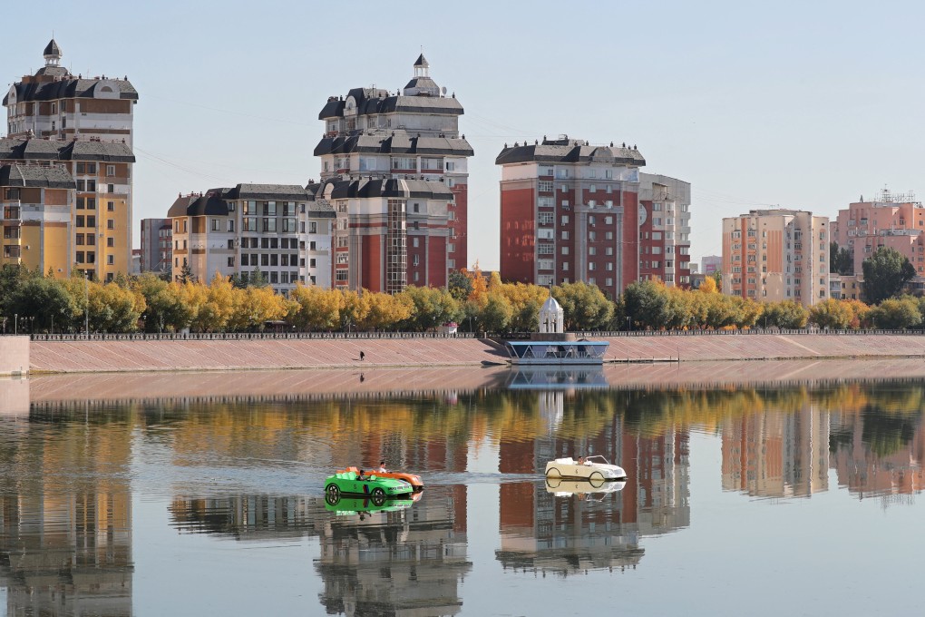 People ride paddle boats on the Ishim River in the city of Astana, Kazakhstan, on October 1. Water scarcity is a consequence of climate change that requires urgent global attention. Photo: Reuters