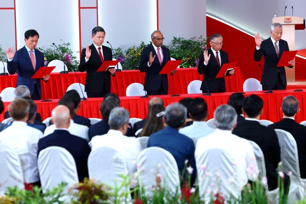 Several of the Singapore ministers attending the swearing-in ceremony of the new cabinet ministers at the Istana on May 23. Photo: EPA-EFE