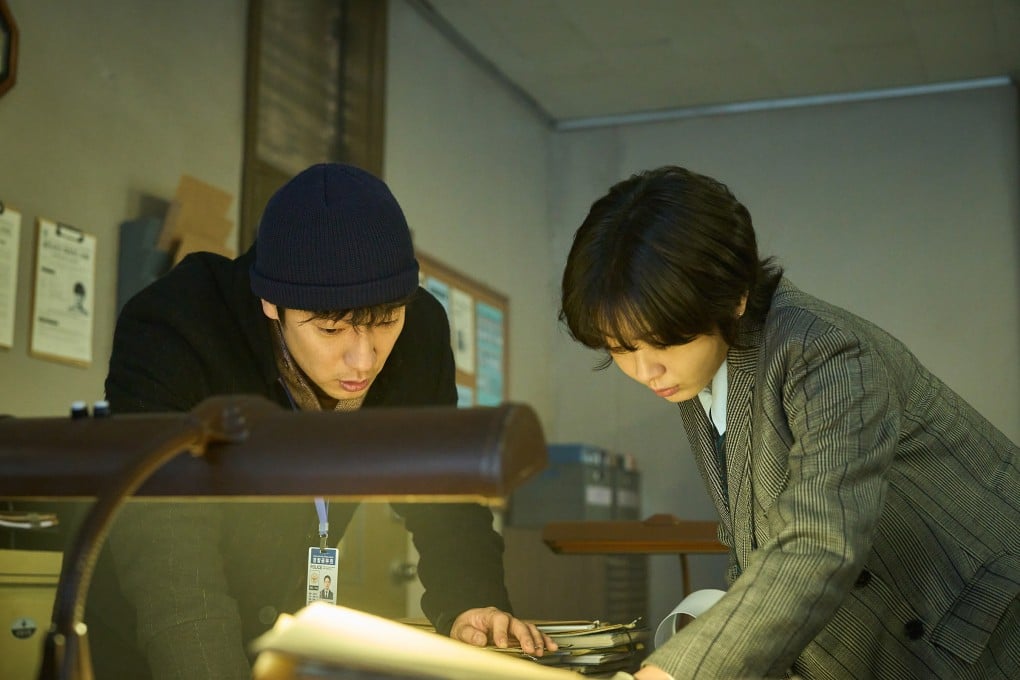 Son Suk-ku (left) as police officer Han-saem and Kim Da-mi as criminal profiler E-na in a still from Nine Puzzles. A decade-long mystery binds the two detectives together. Photo: Disney+