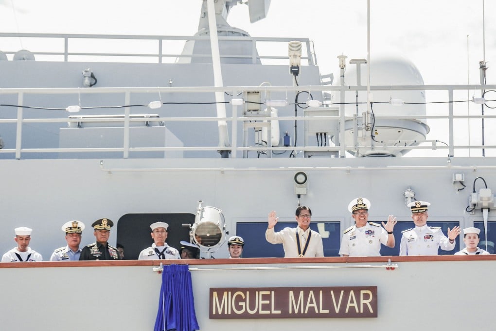 Philippine President Ferdinand Marcos Jnr (centre) waves from the BRP Miguel Malvar at Subic naval base in the Philippines on Tuesday. Photo: Kyodo