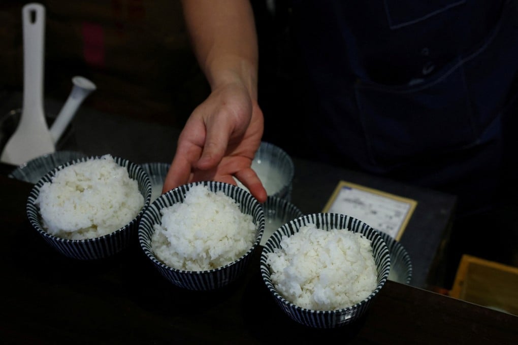 A worker prepares bowls of cooked US-grown Calrose rice to serve to customers at a restaurant in Tokyo. Photo: Reuters