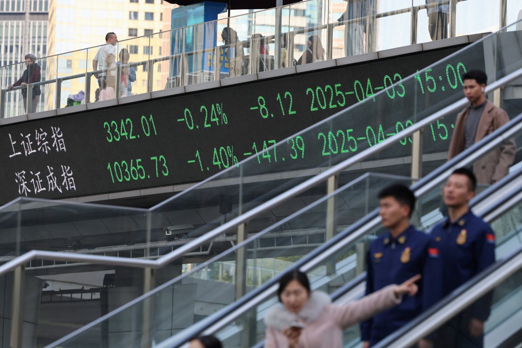 An electronic board shows Shanghai and Shenzhen stock indices as people cross a pedestrian bridge in Shanghai on April 3. China’s top internet watchdog is targeting social media accounts that spread false information about the capital markets. Photo: Reuters