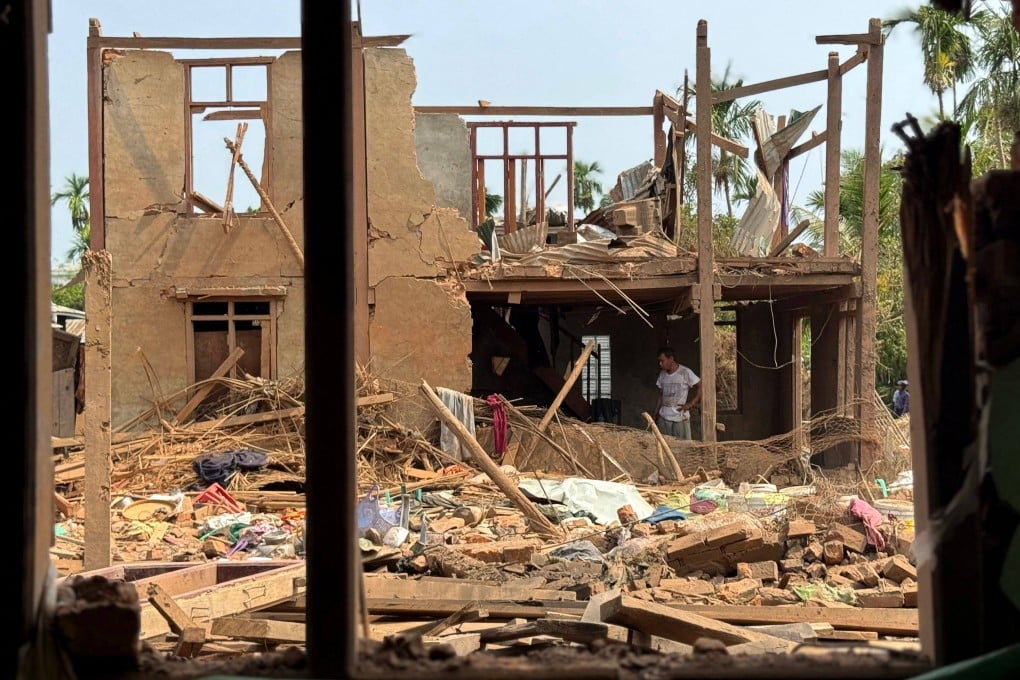 People assess damage in destroyed buildings following Myanmar military airstrikes in Kyauktaw town in Myanmar’s western Rakhine State on May 15. Photo: AFP