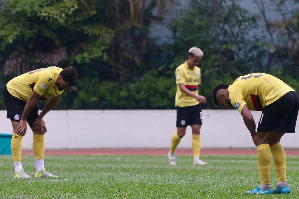 Lee Man players bow their heads after losing the Hong Kong Premier League title on the final day of the season. Photo: Jonathan Wong