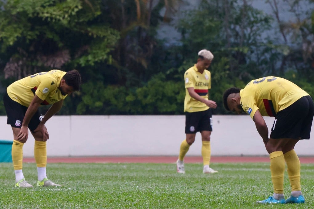 Lee Man players bow their heads after losing the Hong Kong Premier League title on the final day of the season. Photo: Jonathan Wong