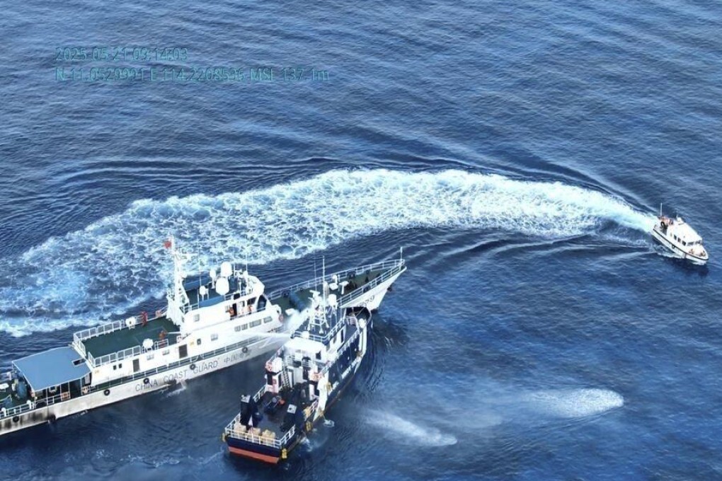 A Chinese Coast Guard ship (left) uses a water cannon and sideswipes a Philippine fisheries vessel on a research mission near Sandy Cay in the disputed South China Sea on Wednesday. Photo: Philippine Coast Guard/AP