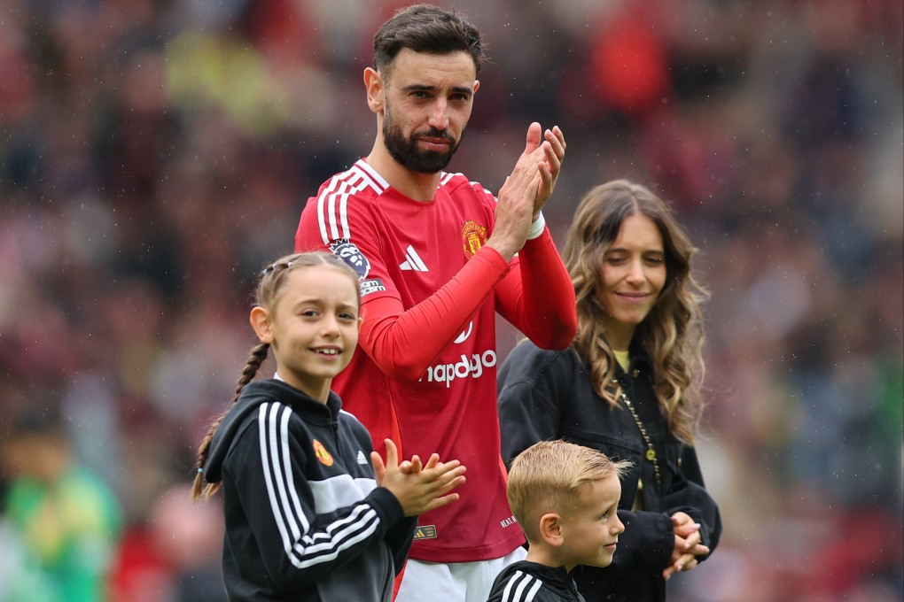 Bruno Fernandes, with his family, applauds the Old Trafford crowd following their final-day 2-0 victory over Aston Villa. Photo: EPA-EFE