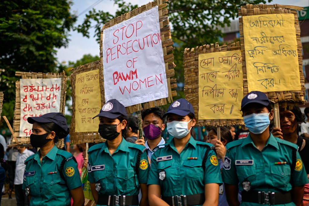 Policewomen stand guard during a friendship march organised to demand equal rights and safety for women in Dhaka, Bangladesh on May 16. China’s  embassy has warned that citizens involved in illegal marriages in the South Asian country risk being arrested for human trafficking. Photo: AP