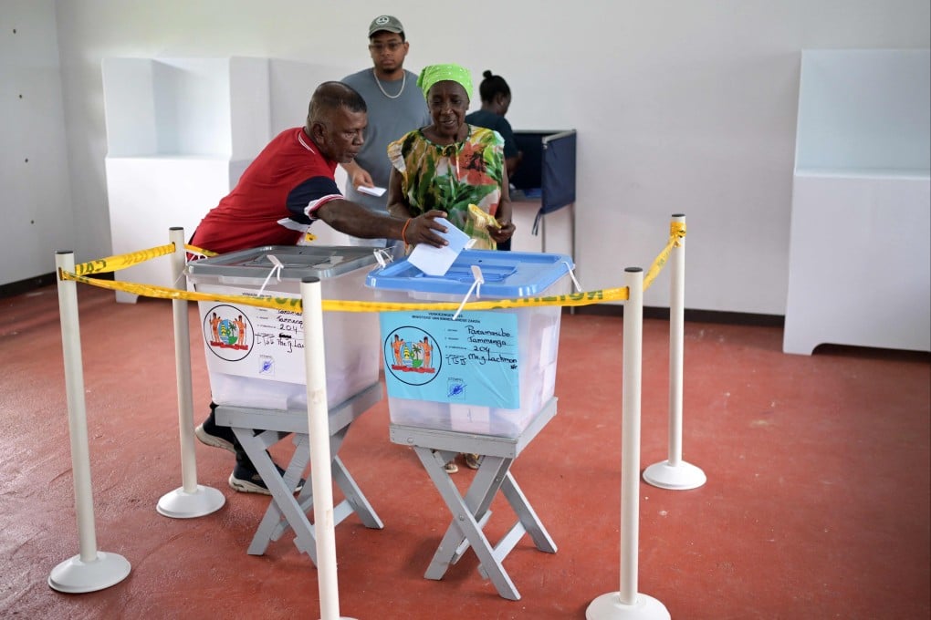 People vote at a polling station during parliamentary elections in Paramaribo, Suriname on Sunday. Photo: AFP