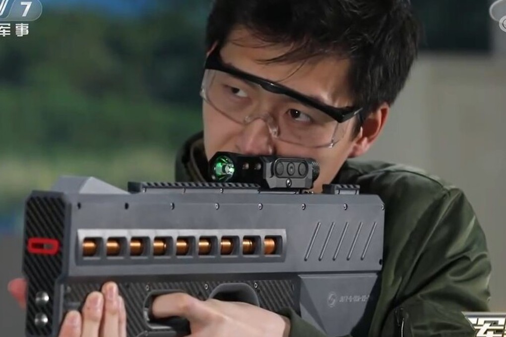 China has unveiled a powerful new electromagnetic gun believed to be powered by lithium batteries. This version (pictured) is a non-lethal weapon that fires coin-shaped bullets with electromagnetic force and would be used for riot control.  Photo: CCTV