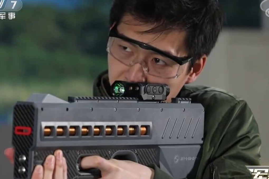 China has unveiled a powerful new electromagnetic gun believed to be powered by lithium batteries. This version (pictured) is a non-lethal weapon that fires coin-shaped bullets with electromagnetic force and would be used for riot control. Photo: CCTV