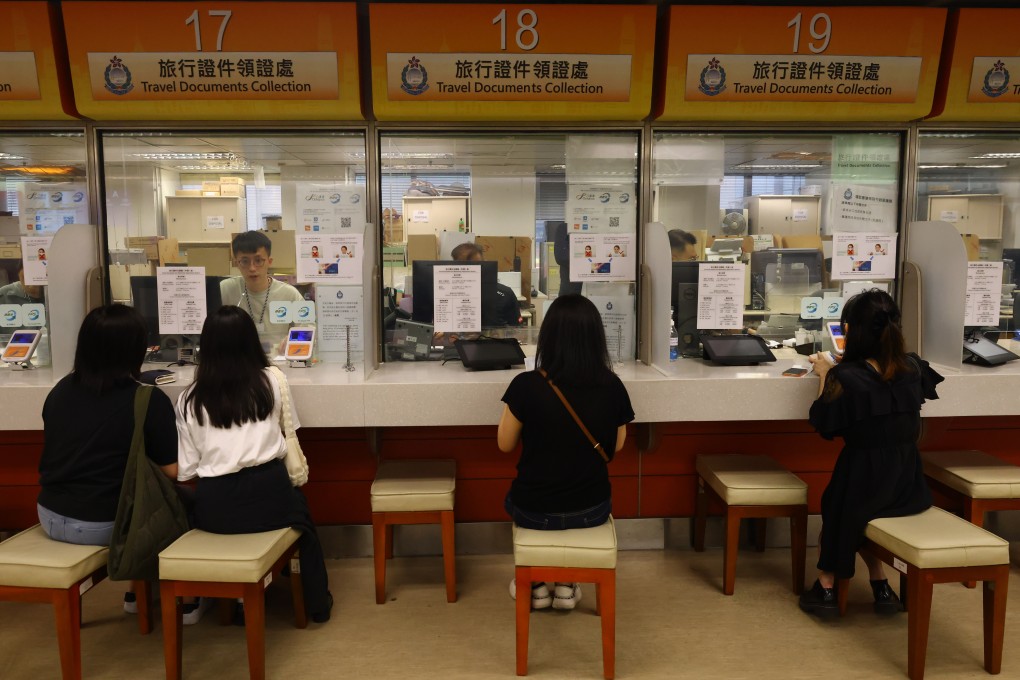 Immigration Department officers attend to residents at the office in Wan Chai. The proposal would improve the cost recovery rate, with the minimum increasing from 14 per cent to 19 per cent and the maximum reaching 100 per cent from 94 per cent. Photo: Dickson Lee