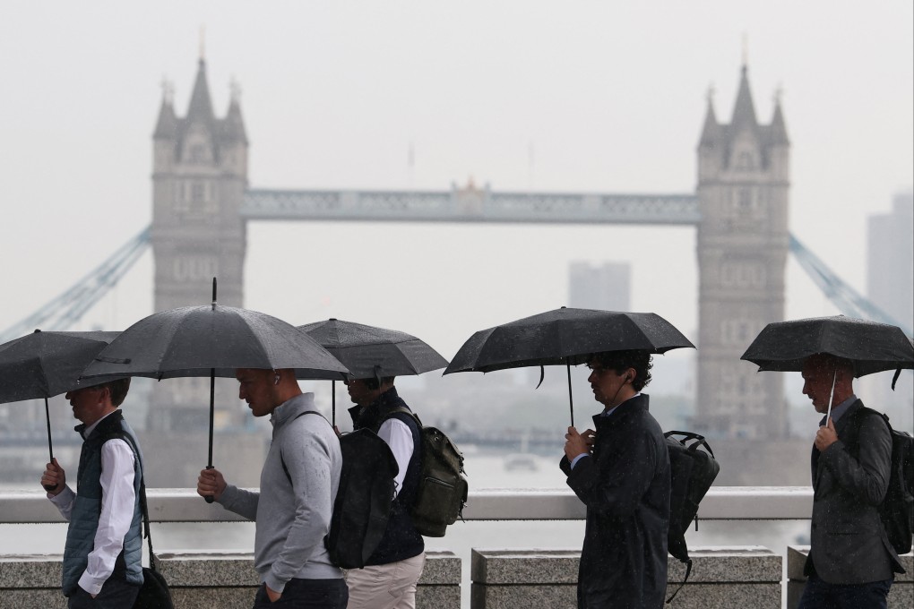 Workers during morning rush-hour in London. Photo: Reuters
