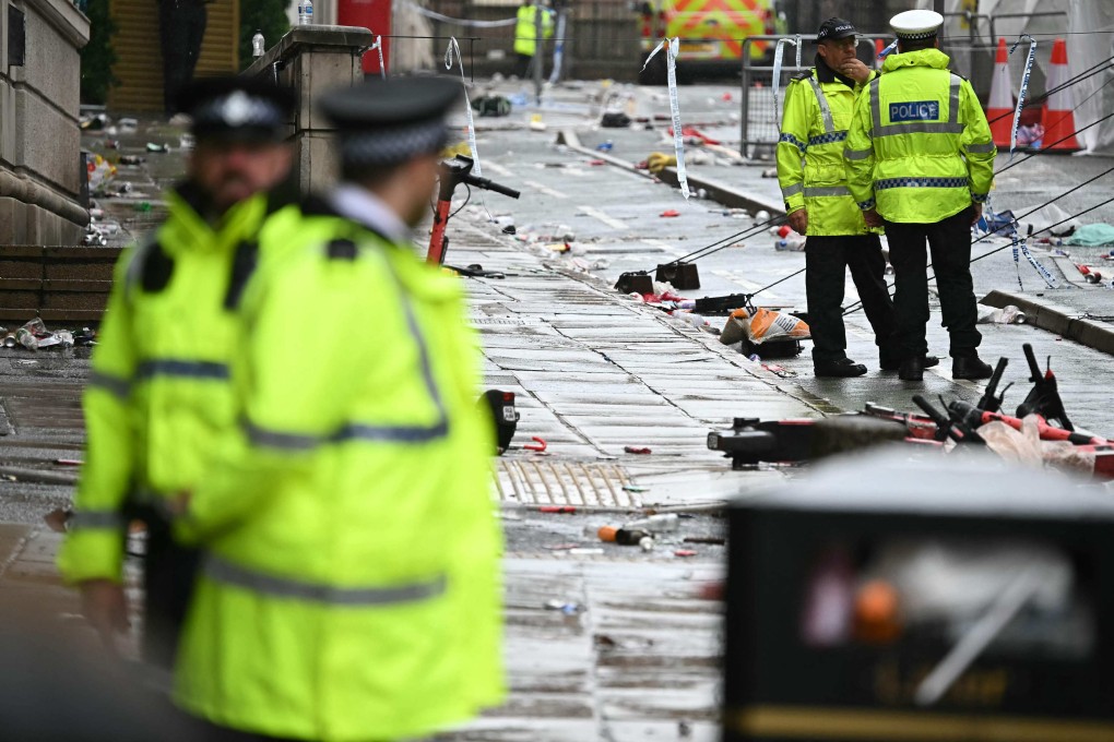 Police officers work at the scene on Water Street in Liverpool on Tuesday. Photo: AFP