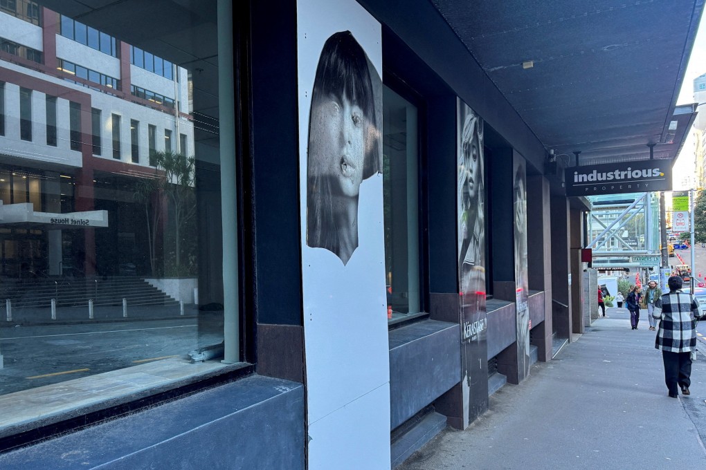 Torn posters adorn a closed-down hair salon in Wellington, New Zealand, earlier this month. Photo: Reuters