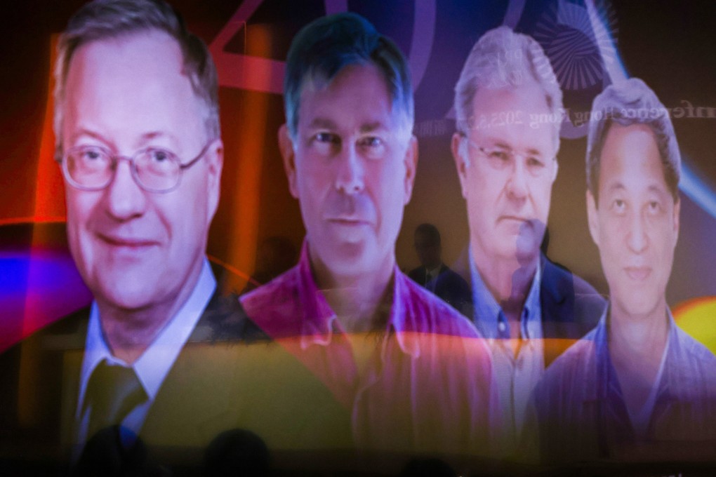 (From left) Images of John Richard Bond, George Efstathiou, Wolfgang Baumeister and Kenji Fukaya are displayed on screen at an announcement of the Shaw Prize winners. Photo: Nora Tam