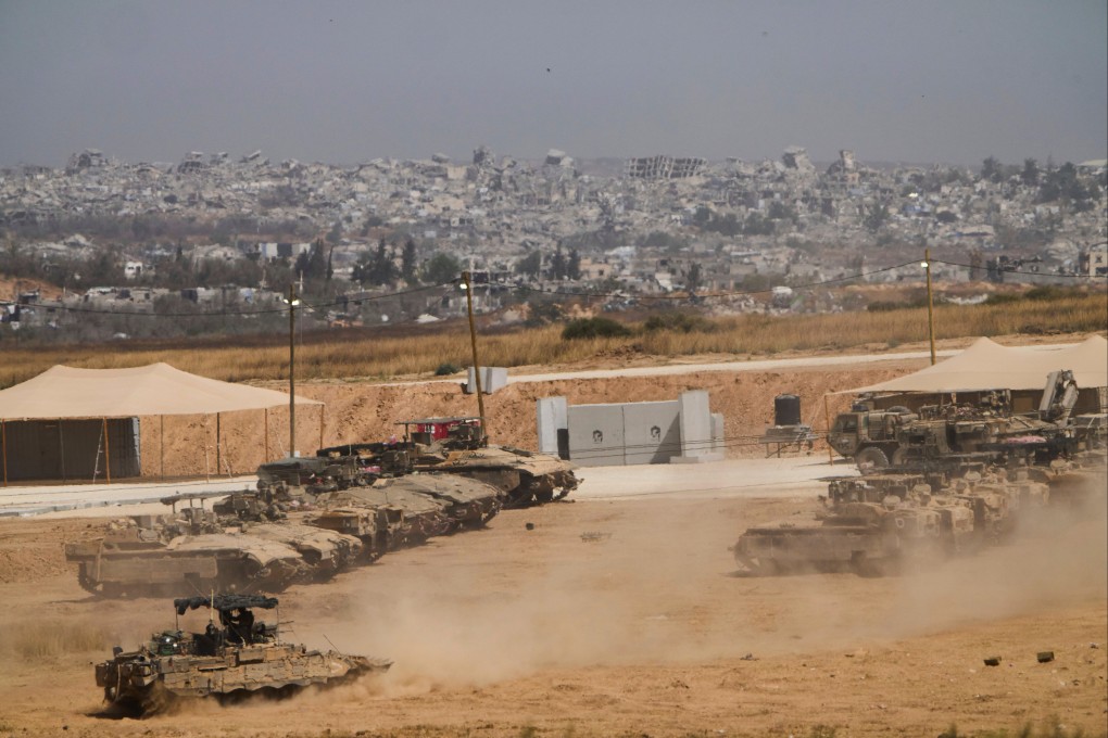 Israeli tanks and armored vehicles at a staging area near the border with the Gaza Strip, in southern Israel. Photo: AP