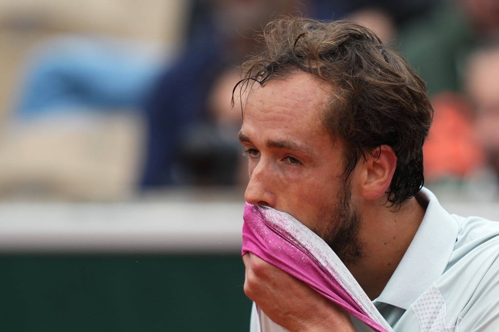 Russia’s Daniil Medvedev wipes his face with his jersey in his five-set defeat to Britain’s Cameron Norrie on day 3 of the French Open on Tuesday. Photo: AFP