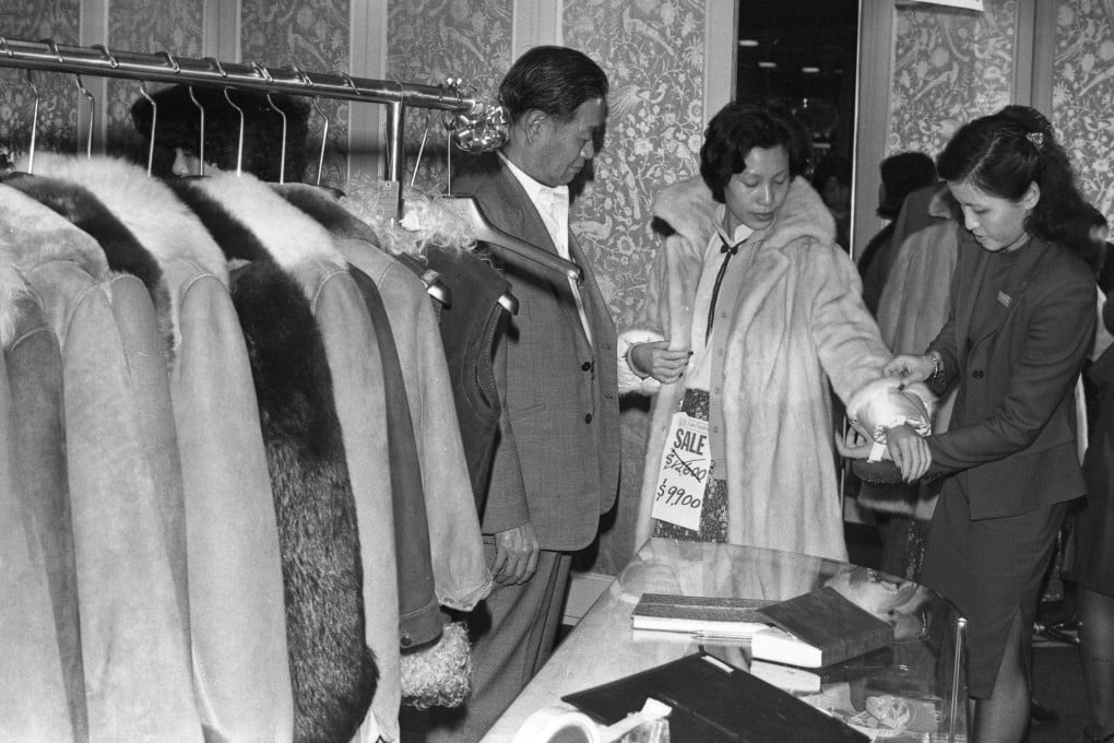 A woman tries on a fur coat in the Hong Kong winter of 1979. Photo: SCMP Archives