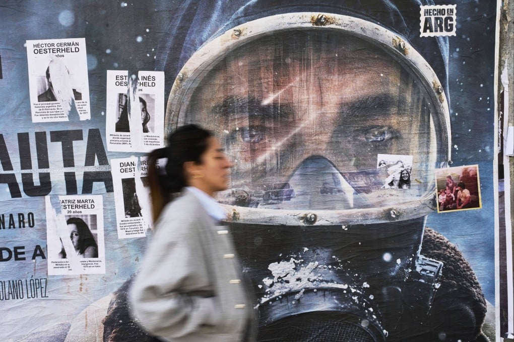 An advertisement for Netflix’s new series The Eternaut is partially covered by posters of sci-fi comic author Hector Oesterheld and his daughters - who were forcibly disappeared in 1977 during Argentina’s military dictatorship - in Buenos Aires, Argentina, on May 6, 2025. Photo: AP