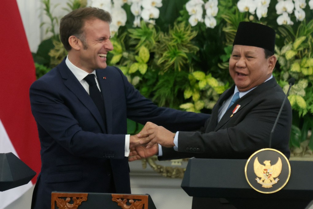 France’s President Emmanuel Macron (left) laughs with Indonesian President Prabowo Subianto  at a joint press conference in Jakarta, Indonesia on Wednesday. Photo: EPA-EFE