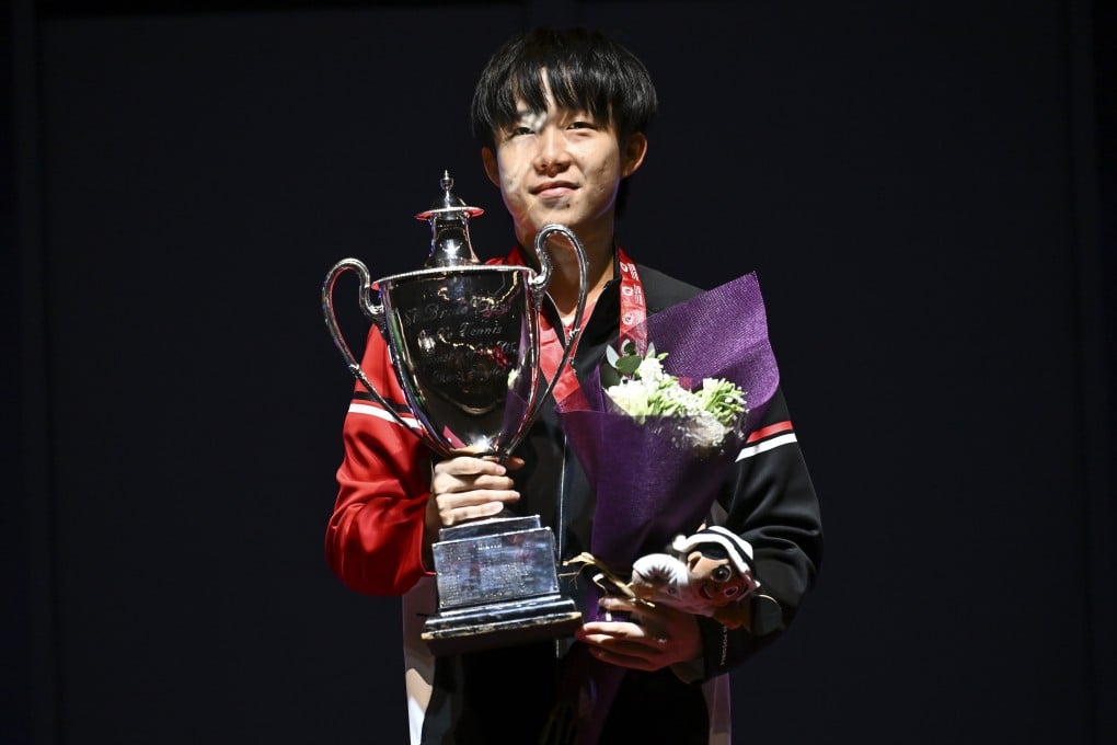 China’s Wang Chuqin poses with the trophy during the medal ceremony after securing victory in the men’s singles event at the World Table Tennis Championships. Photo: EPA