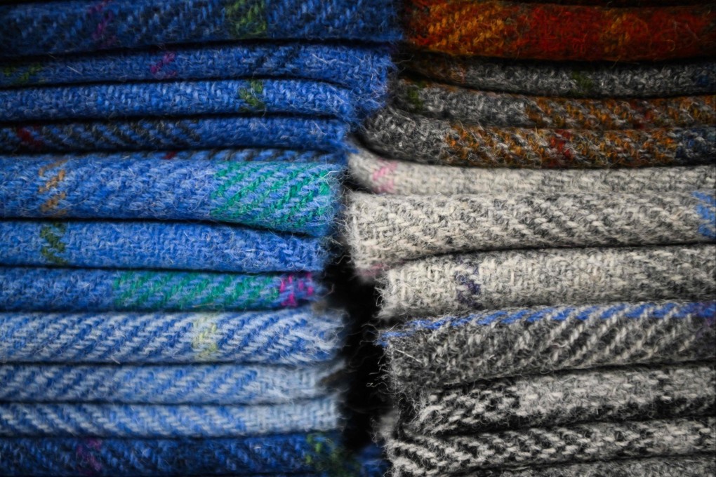 Harris tweed stoles are displayed at the Harris Tweed Isle of Harris shop, in Tarbert, Isle of Harris, in Scotland’s Outer Hebrides. Photo: AFP