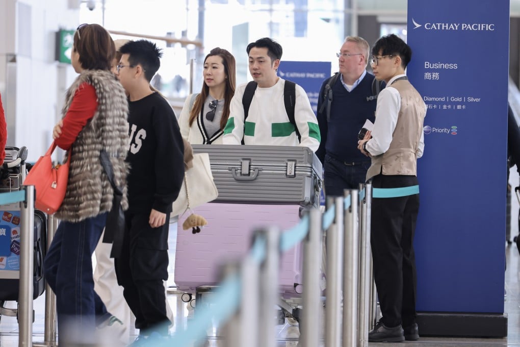 Ground staff and travellers at Hong Kong International Airport. A new second terminal is set to partially open in September. Photo: Nora Tam