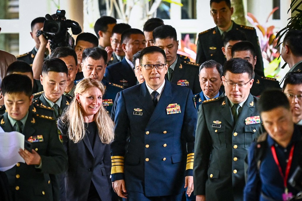 Chinese Defence Minister Dong Jun (centre) walks out following a bilateral meeting with then US Defence Secretary Lloyd Austin on the sidelines of the 21st Shangri-La Dialogue in Singapore on May 31 of last year. Photo: AFP