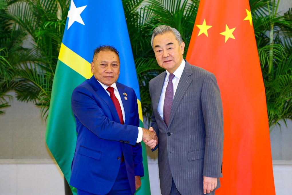 Solomon Islands’ Peter Shanel Agovaka (left) and top Chinese diplomat Wang Yi at the China-Pacific Island Countries foreign ministers’ meeting in Xiamen on Wednesday. Photo: Xinhua