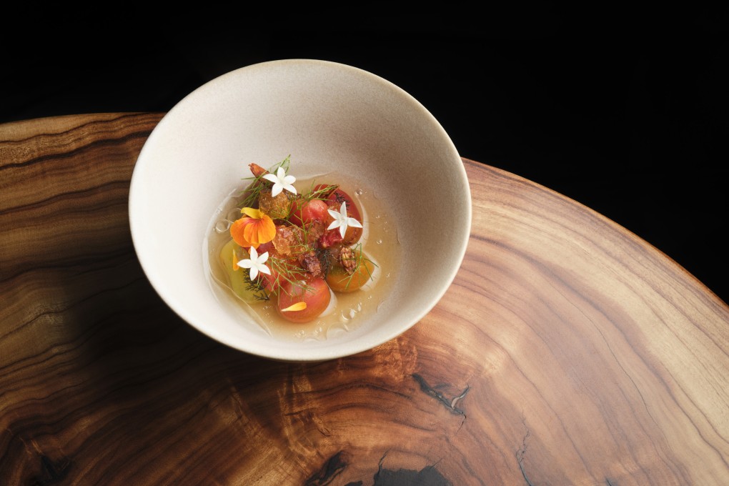 Farmhouse tomatoes in perilla and coal with fermented pistachio, at Roganic in Hong Kong. Photo: Handout
