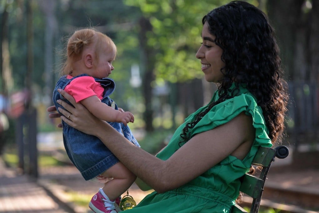Brazilian YouTuber Gabi Matos holds a reborn baby doll from her collection in Campinas, Sao Paulo state, Brazil. The hyperrealistic dolls have unleashed a media, social and even legislative storm in Brazil. Photo: AFP