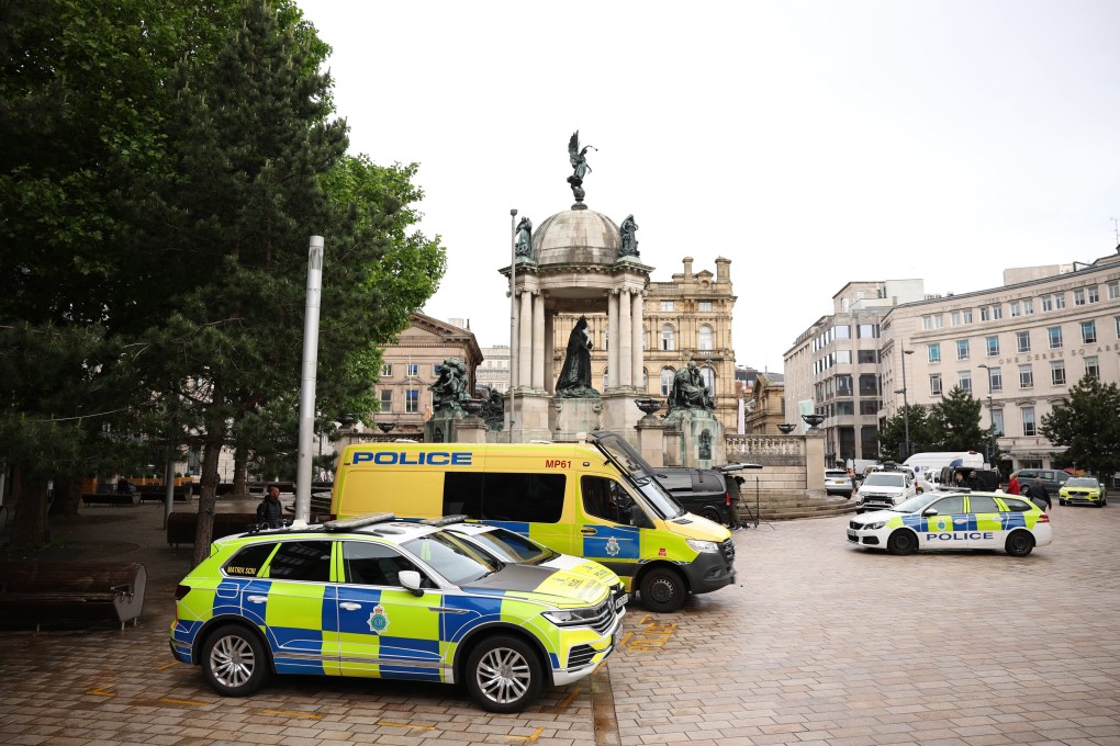 Police vehicles are parked outside Liverpool Magistrates’ Court in Liverpool, where 53 year-old Paul Doyle was charged following a Monday incident on Water Street during the Liverpool FC trophy parade. Photo: EPA-EFE