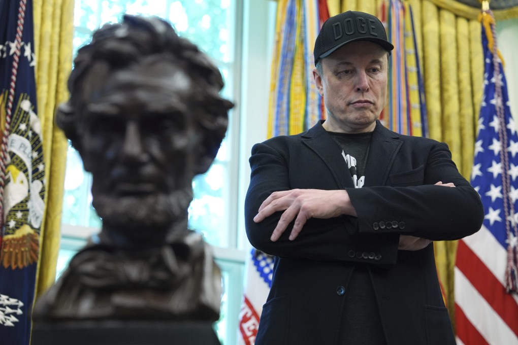 Elon Musk listens as US President Donald Trump (not pictured) speaks during a news conference in the Oval Office on Friday. Photo: AP
