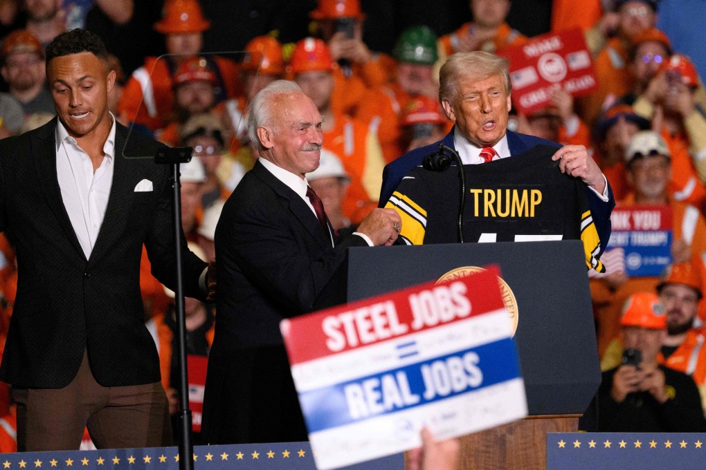 US President Donald Trump receives a Pittsburgh Steeler jersey from NFL Super Bowl champion Rocky Bleier during a rally at the US Steel-Irvin Works on Friday. Photo: Getty Images via AFP
