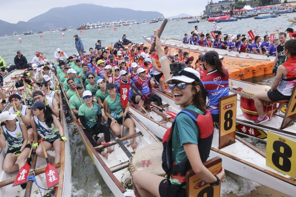 Dragon boat paddlers race in Stanley. Photo: Nora Tam